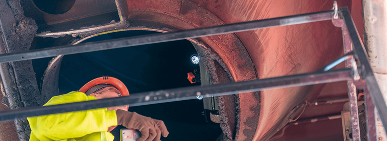 Astec Silobot inspecting the inside of a cone of an asphalt storage silo