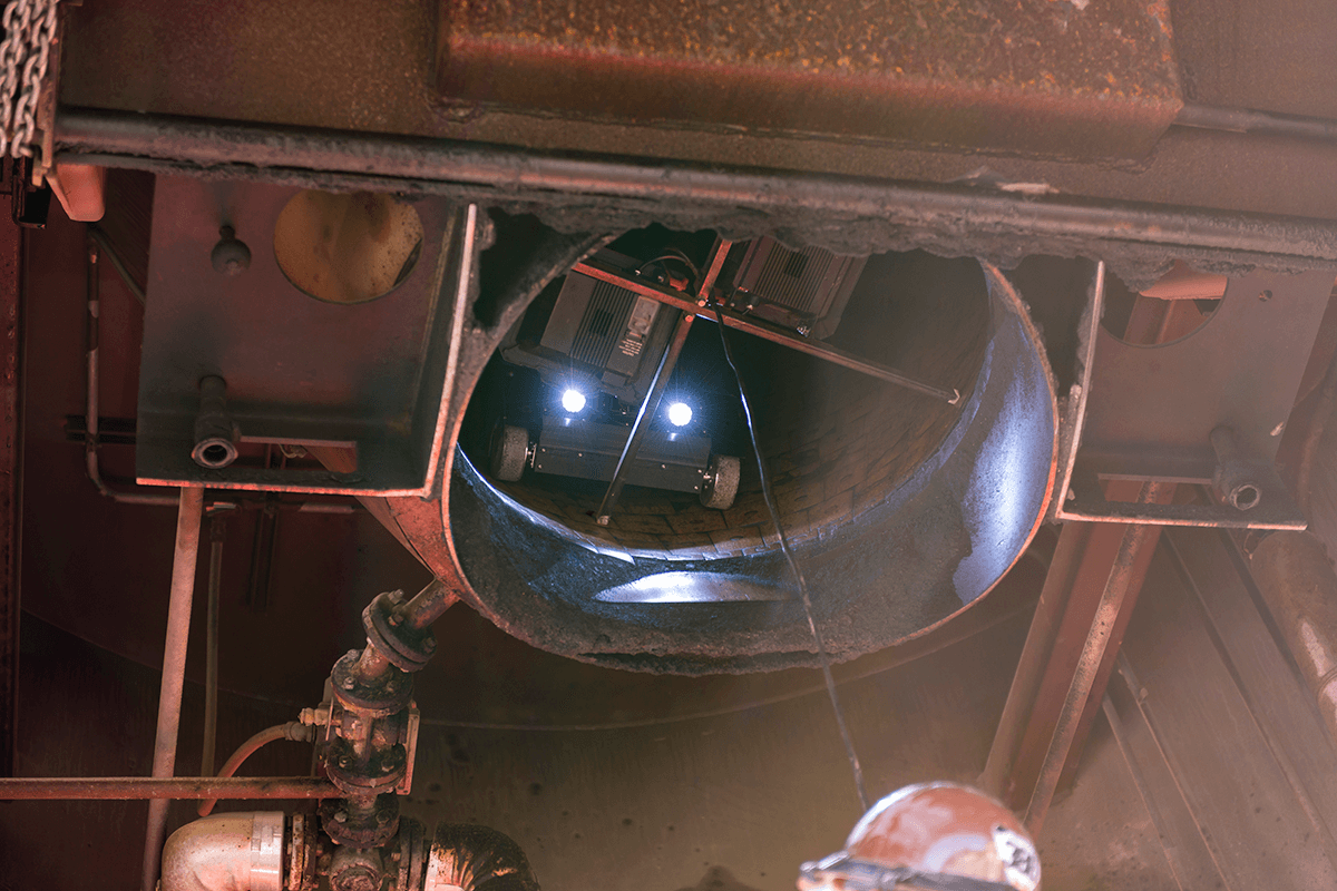 Astec Silobot inspection robot examining the inside of an asphalt storage silo