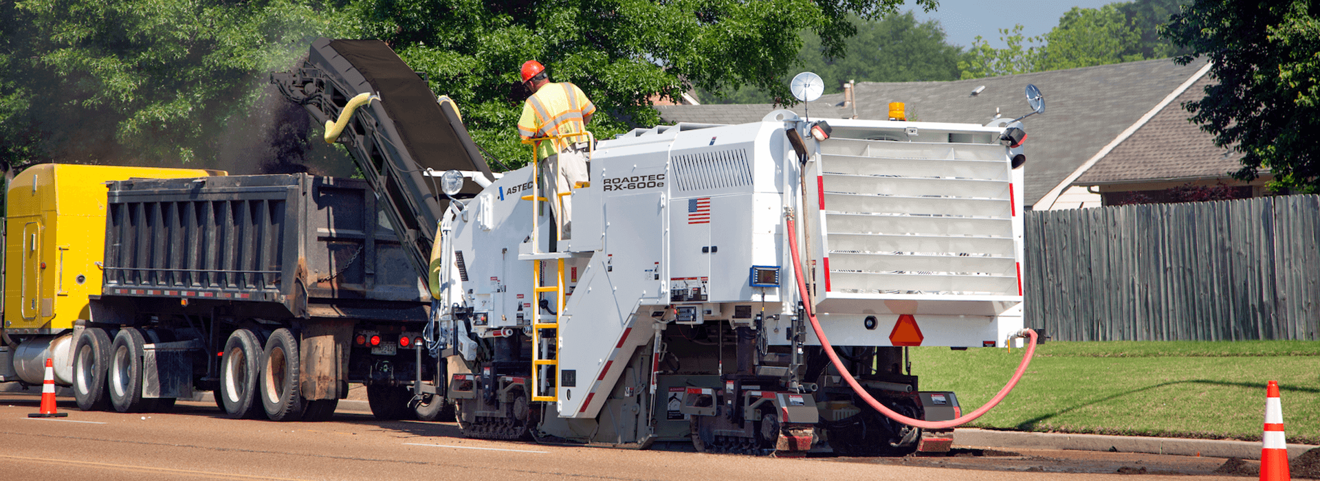 Roadtec RX-600 Cold Planer milling asphalt of road surface into a dump truck