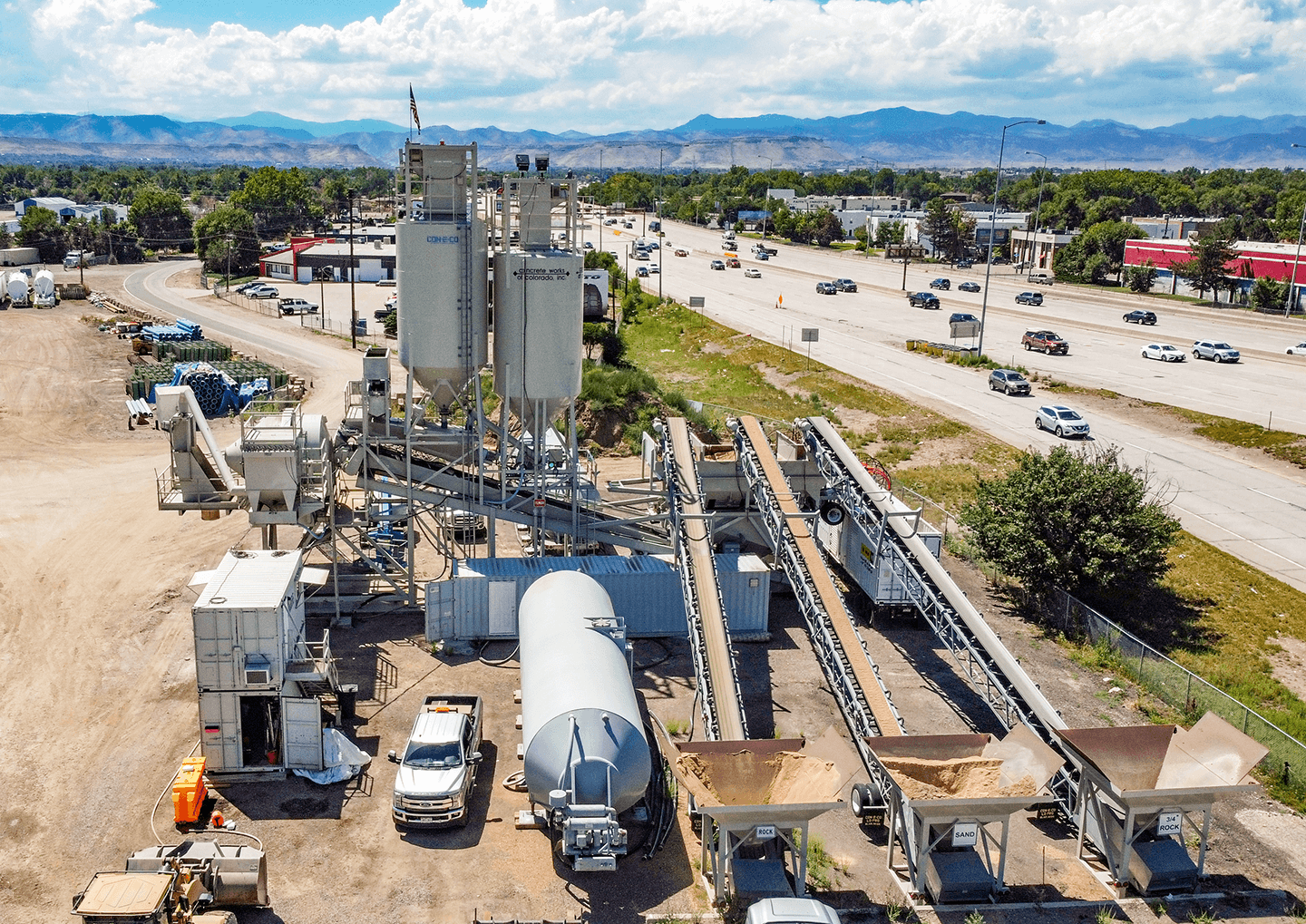 Concrete Works of Colorado Astec CON-E-CO ALL PRO concrete batch plant beside road