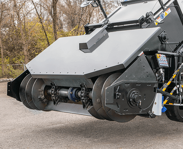The Roadtec SB-3000 Shuttle Buggy Material Transfer Vehicle showing the front hopper removed with the quick change system in place