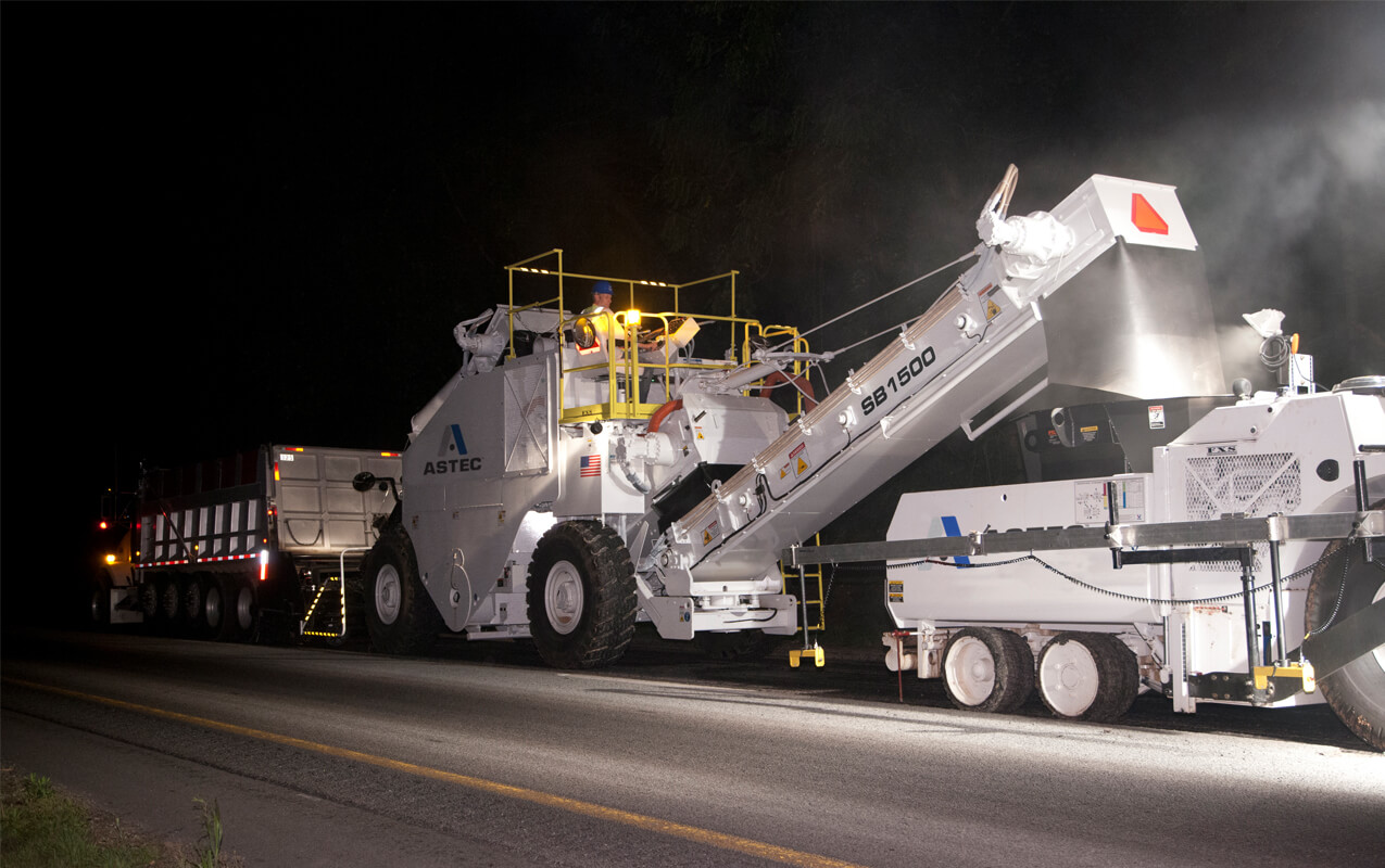 Roadtec SB-1500 Material Transfer Vehicle Working at Night