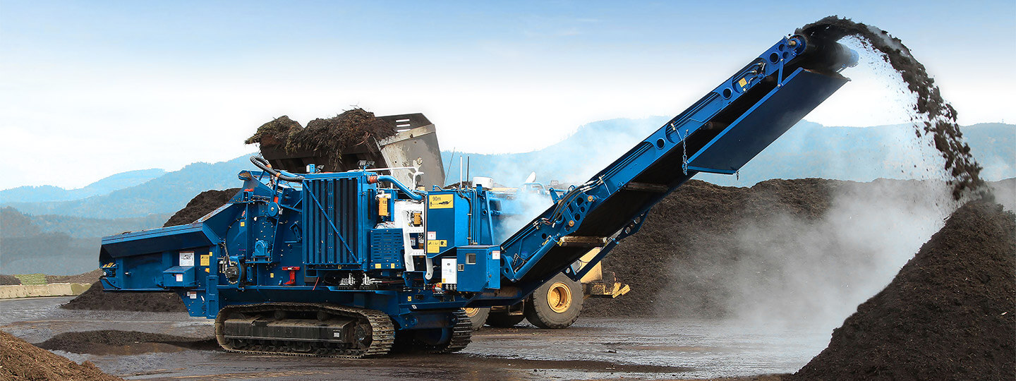 Compost production with horizontal grinder using wheel loader